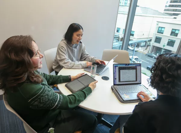 three admins meeting in conference room
