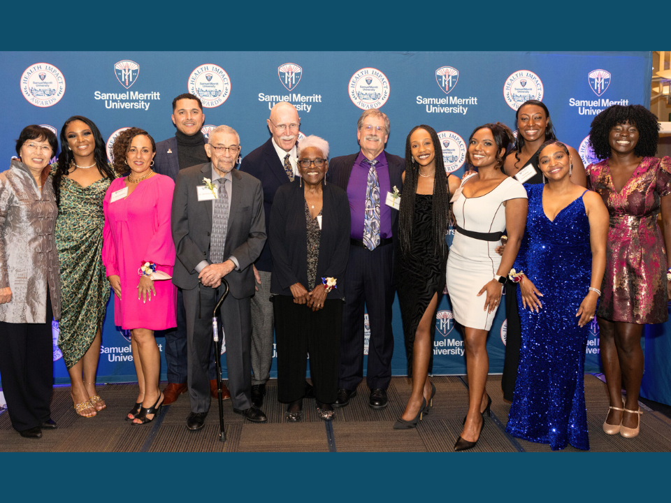 The 2023 Health Impact Award recipients together in front of an SMU banner