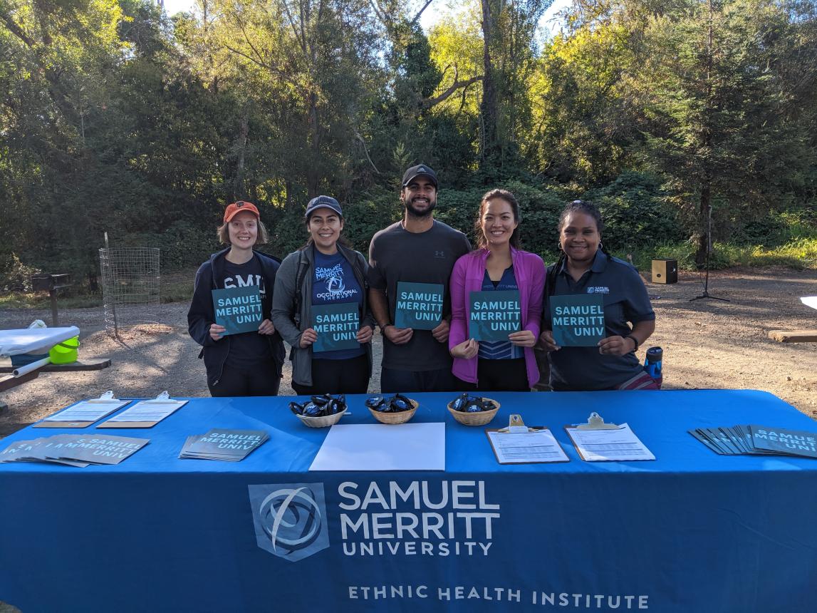 SMU students at SMU table during International Peace Day event