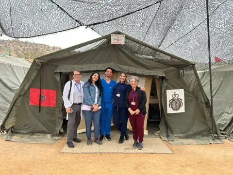 Peter Chordas and his team in Morocco under military tent