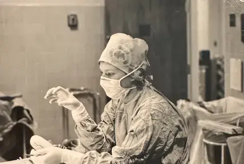 Rondi Crowley in operating room wearing scrubs