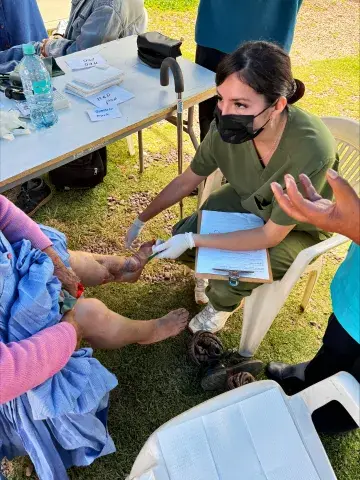 Student working on patient's foot