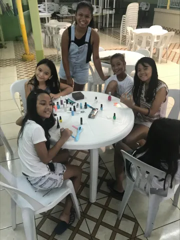 Julianna Sabile with elementary school students in Manila