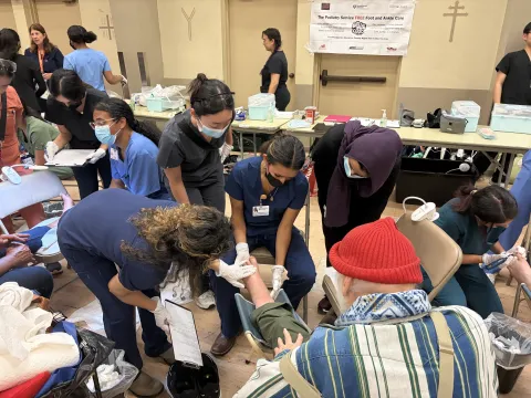 Group of students caring for patient's feet