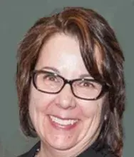 Headshot of woman with short dark hair