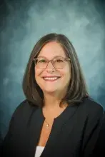 Headshot of woman with shoulder length hair