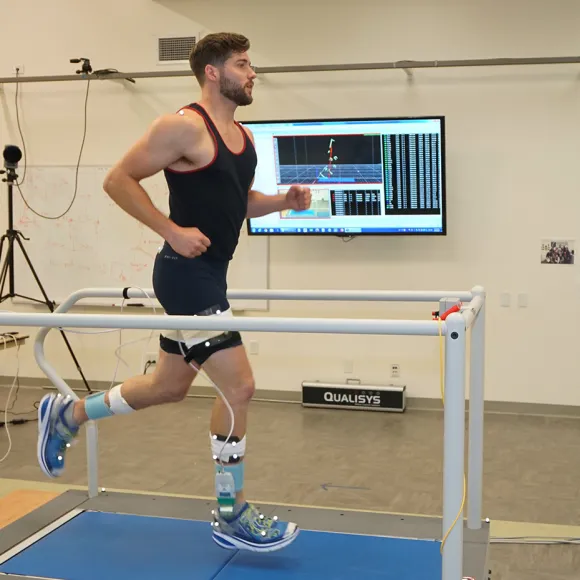 Student running in lab