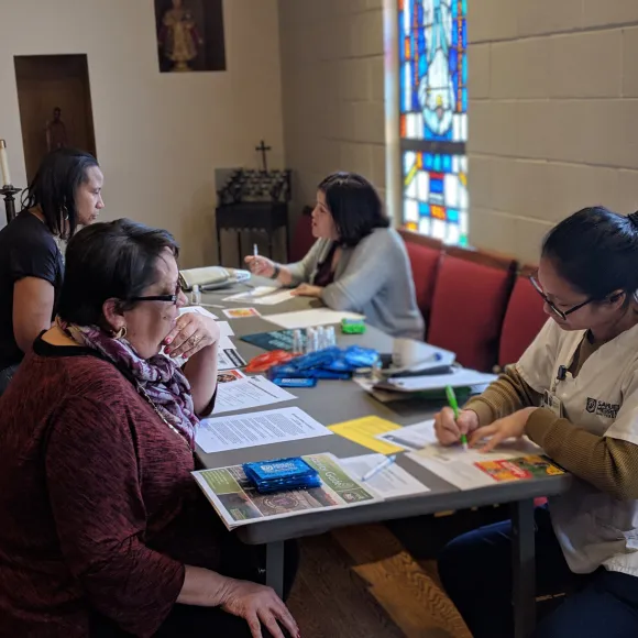 SMU student provides free blood pressure screening to community member