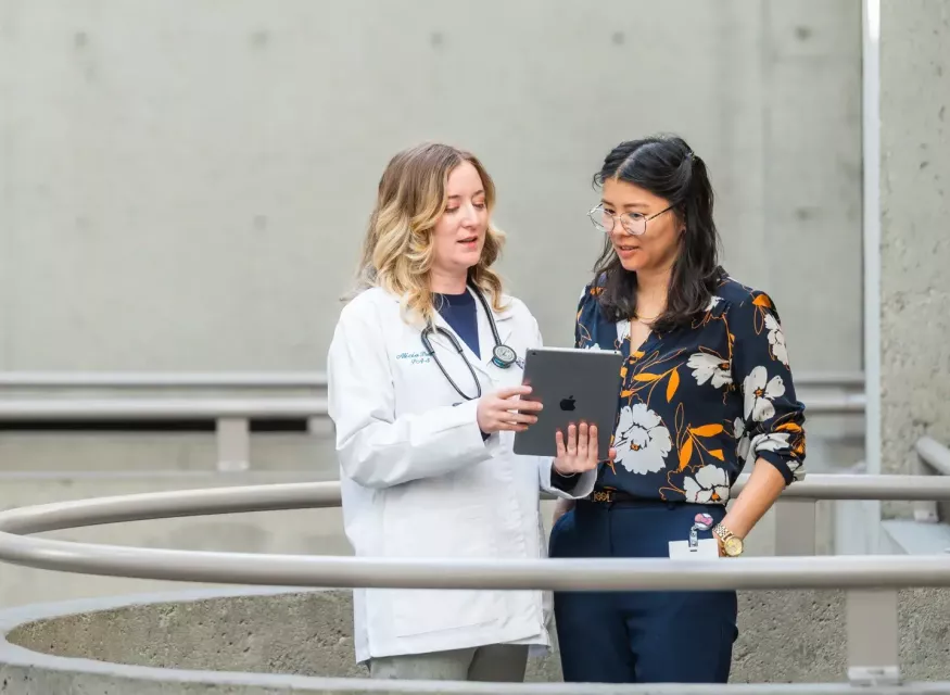 Physician Assistant consulting with Physician