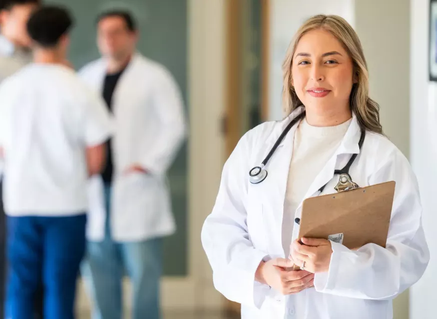 Doctor of Nursing Practice facing camera