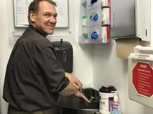 Peter Chordas washing hands in medical office