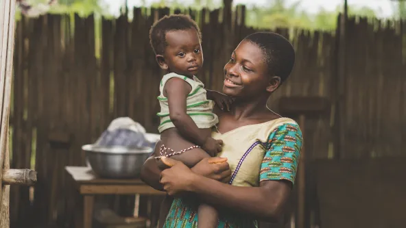 women holding baby