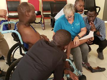 Professor Sharon Gorman demonstrates treatment to Burundi physical therapists