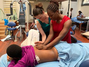 Rachel Gelman, DPT '12, (left) trains a physical therapist on pelvic floor care in Nairobi, Kenya.