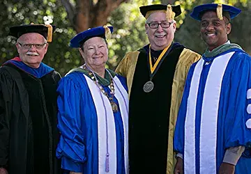 President Sharon Diaz group graduation regalia