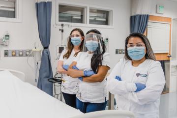 BSN nursing students pose in sim lab