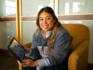 Student reading from iPad