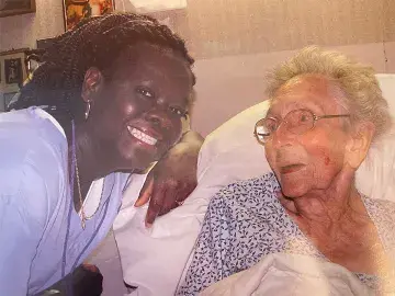 Florence Edwards (left) poses with one of the seniors she worked with.