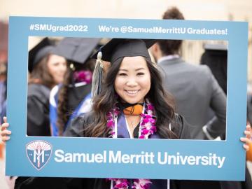 Smiling SMU graduate on Commencement Day