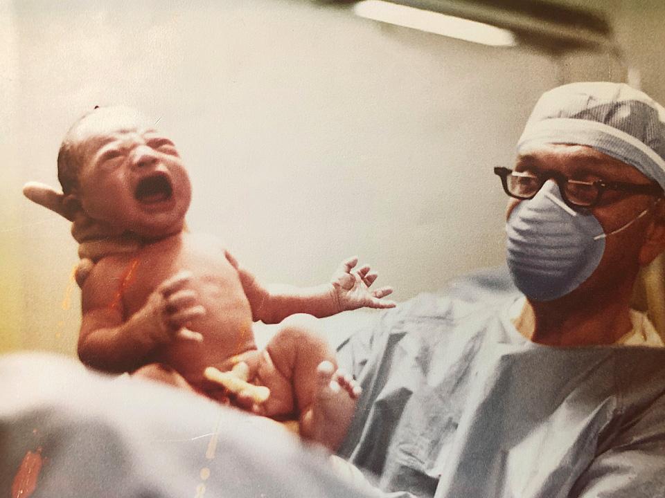 Dr. Mike Milliken delivers a baby.
